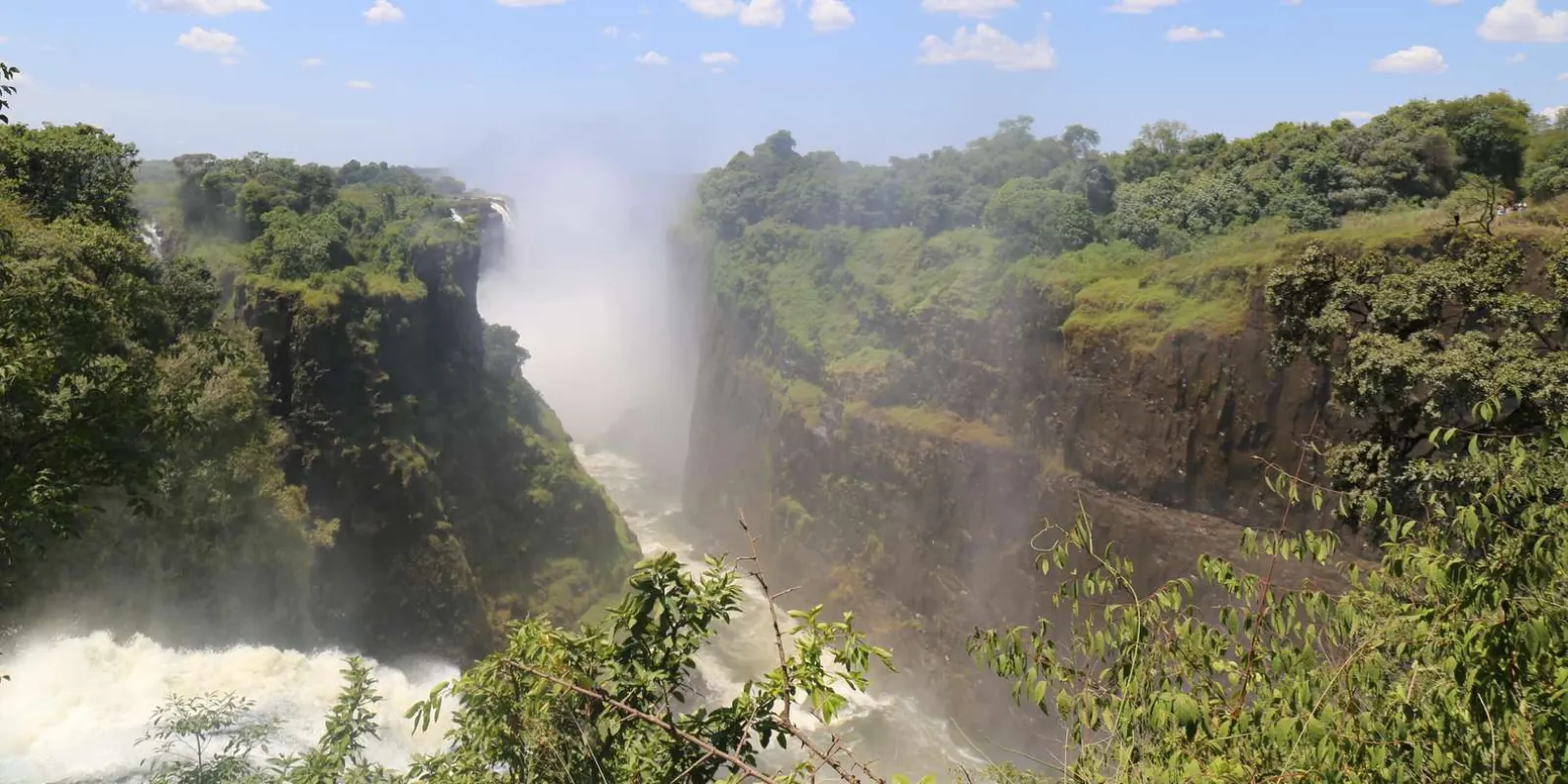 Victoria Falls Bridge and gorge viewed from a helicopter, showing the Zimbabwe–Zambia border crossing